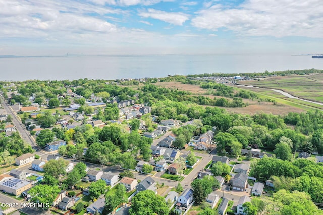 aerial perspective of suburban area featuring a large body of water