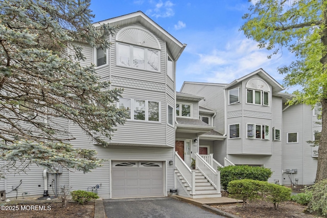 142 Orchid Ct, Toms River, NJ 08753 - view of front of home featuring a garage and asphalt driveway
