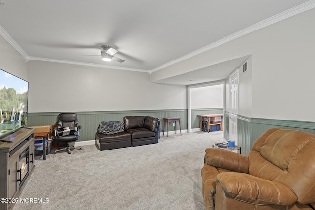 142 Orchid Ct, Toms River, NJ 08753 - carpeted living area with ornamental molding, wainscoting, ceiling fan, and a desk