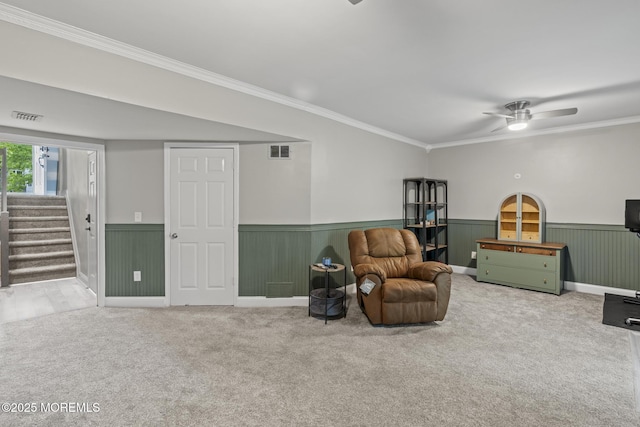 142 Orchid Ct, Toms River, NJ 08753 - sitting room with carpet, ornamental molding, stairway, a wainscoted wall, and ceiling fan