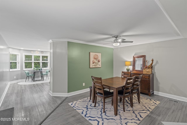142 Orchid Ct, Toms River, NJ 08753 - dining area featuring baseboards, ceiling fan, wood finished floors, and ornamental molding