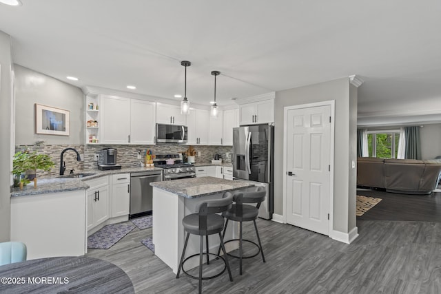 142 Orchid Ct, Toms River, NJ 08753 - kitchen with stainless steel appliances, a sink, white cabinetry, light stone countertops, and recessed lighting