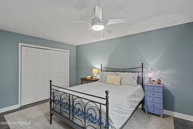 142 Orchid Ct, Toms River, NJ 08753 - bedroom with a closet, baseboards, a ceiling fan, and wood finished floors