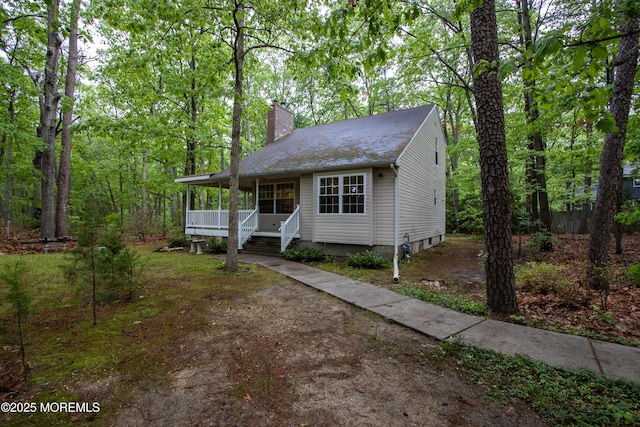 3257 Ridgeway Blvd, Manchester, NJ 08759 - view of front facade featuring a chimney and roof with shingles