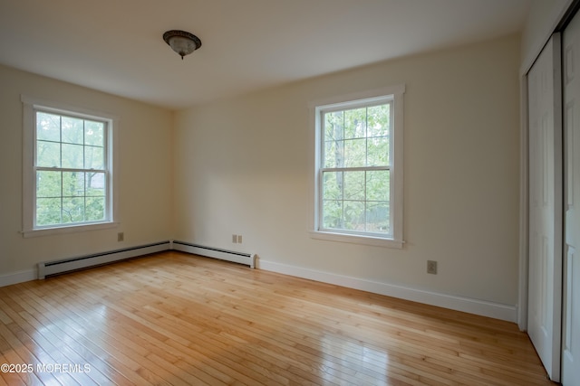 3257 Ridgeway Blvd, Manchester, NJ 08759 - empty room with hardwood / wood-style flooring, baseboards, and a baseboard radiator