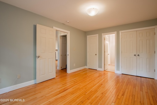 3257 Ridgeway Blvd, Manchester, NJ 08759 - unfurnished bedroom with light wood-style flooring, baseboards, and ensuite bathroom