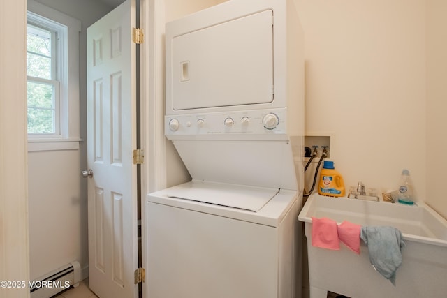 3257 Ridgeway Blvd, Manchester, NJ 08759 - laundry area with stacked washing machine and dryer and a baseboard radiator