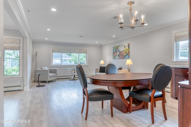 129 Guadeloupe Dr, Toms River, NJ 08757 - dining area with baseboard heating, plenty of natural light, light wood-style flooring, a chandelier, and crown molding