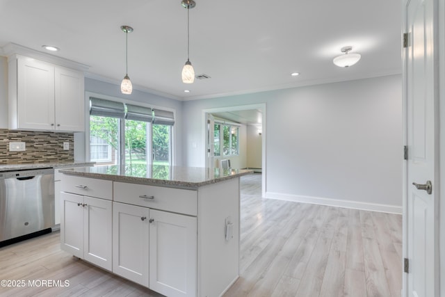 129 Guadeloupe Dr, Toms River, NJ 08757 - kitchen featuring stainless steel dishwasher, ornamental molding, light wood finished floors, white cabinetry, and decorative backsplash