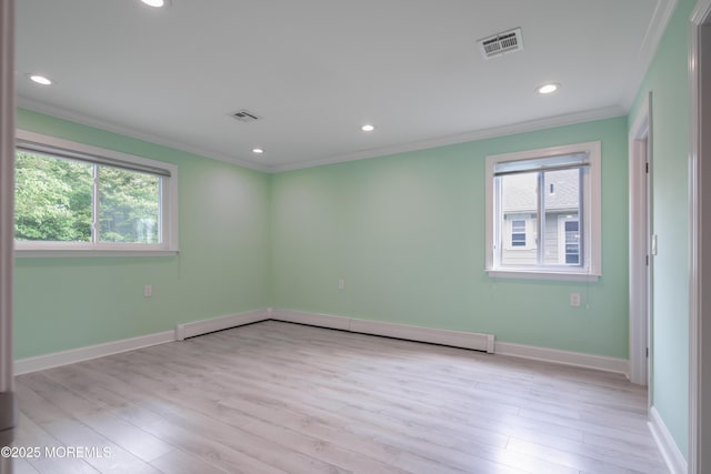 129 Guadeloupe Dr, Toms River, NJ 08757 - empty room featuring crown molding, healthy amount of natural light, recessed lighting, baseboards, and light wood finished floors