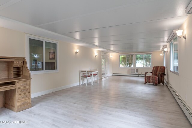 129 Guadeloupe Dr, Toms River, NJ 08757 - living area featuring a baseboard heating unit, light wood-style flooring, and baseboards