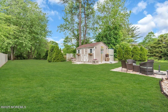 view of yard with a shed, an outdoor structure, and a patio