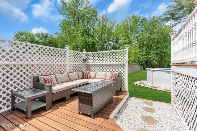 deck with an outdoor living space and an outdoor pool