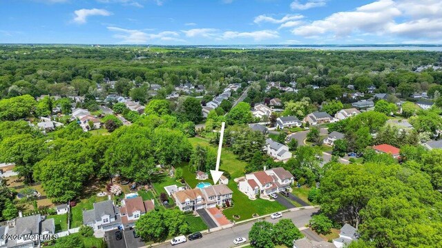 aerial view of residential area with a forest