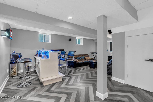 exercise area featuring baseboards and recessed lighting