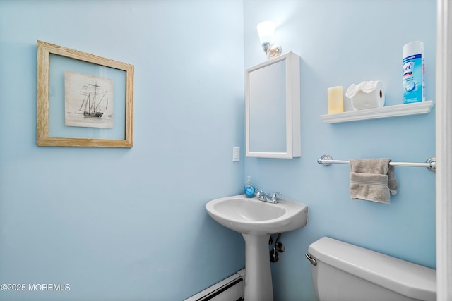 bathroom featuring toilet and a sink