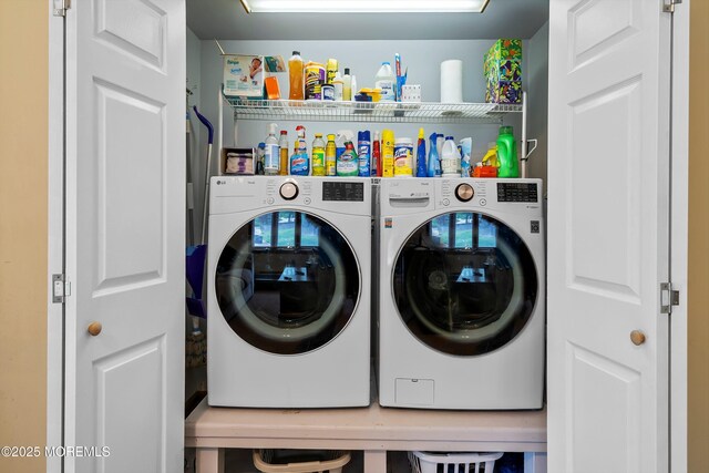 clothes washing area featuring washing machine and dryer