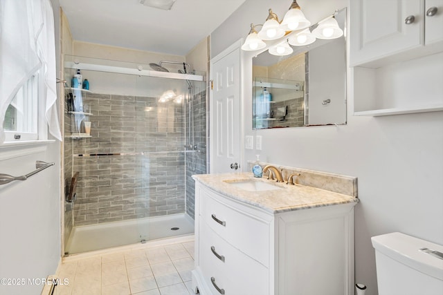 full bath featuring a shower stall, toilet, and vanity