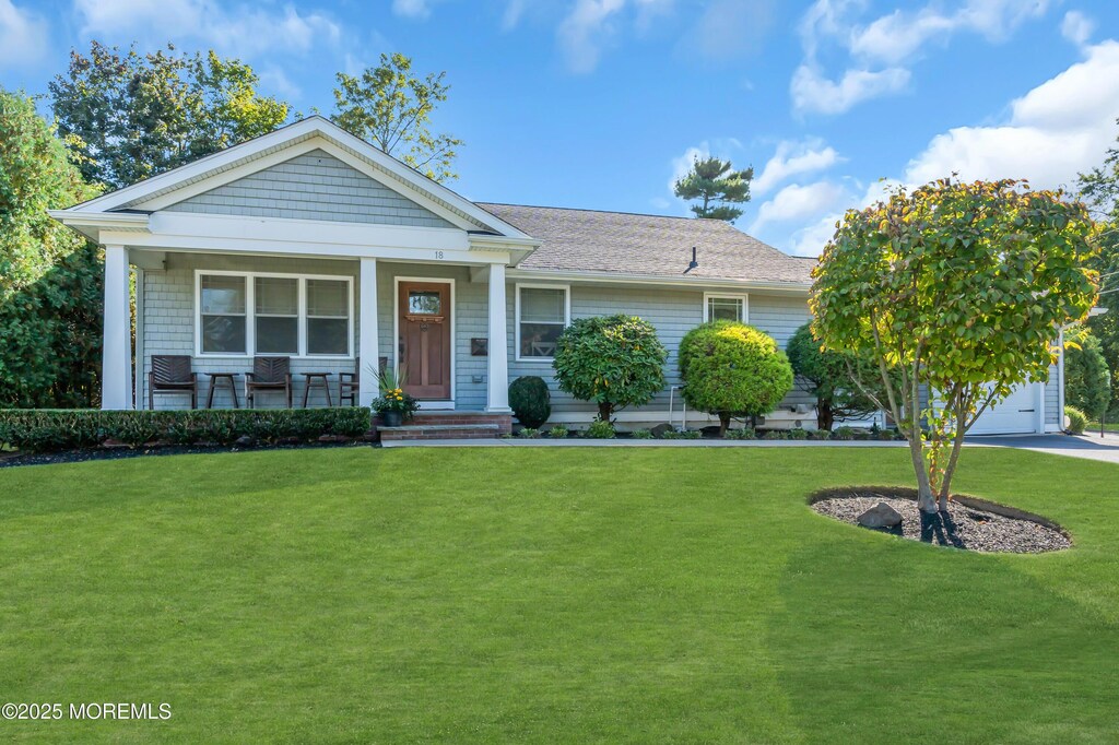 18 Franklin Pkwy, West Long Branch, NJ 07764 - view of front of home featuring a porch, a front lawn, and a garage