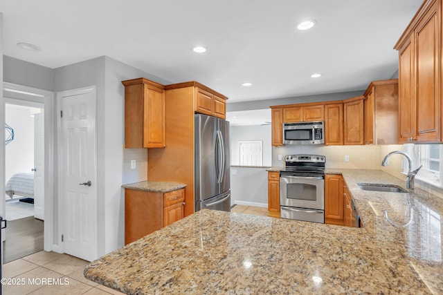 18 Franklin Pkwy, West Long Branch, NJ 07764 - kitchen with appliances with stainless steel finishes, a sink, backsplash, light stone counters, and recessed lighting