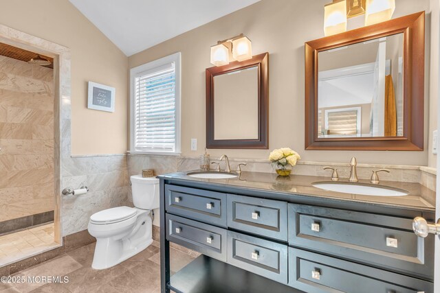 18 Franklin Pkwy, West Long Branch, NJ 07764 - full bath featuring lofted ceiling, tile walls, toilet, double vanity, and a tile shower