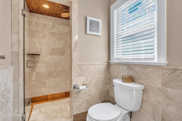 18 Franklin Pkwy, West Long Branch, NJ 07764 - full bathroom featuring tile walls, tiled shower, toilet, and wainscoting