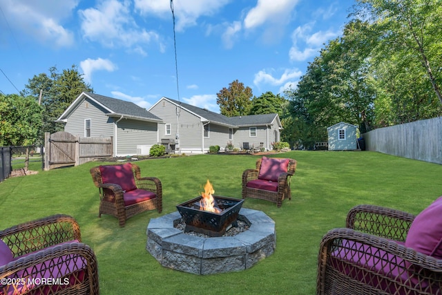 18 Franklin Pkwy, West Long Branch, NJ 07764 - view of yard with a fire pit, a storage unit, an outbuilding, and a gate