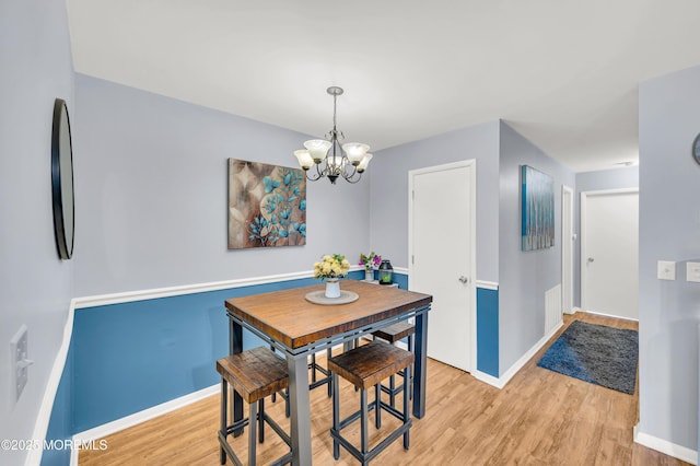 3403 Bridge Ave Unit 2, Point Pleasant, NJ 08742 - dining room with a chandelier, light wood-type flooring, and baseboards