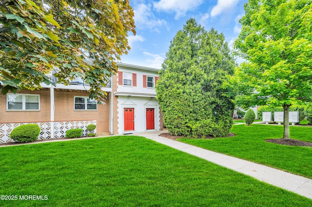 3403 Bridge Ave Unit 2, Point Pleasant, NJ 08742 - view of property hidden behind natural elements with a front lawn