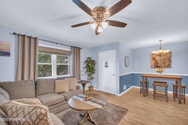 3403 Bridge Ave Unit 2, Point Pleasant, NJ 08742 - living room with a chandelier, light wood finished floors, baseboards, and ceiling fan