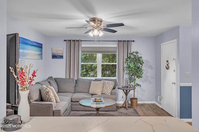 3403 Bridge Ave Unit 2, Point Pleasant, NJ 08742 - living area featuring a ceiling fan, wood finished floors, and baseboards
