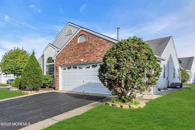 20 Abergele Dr, Toms River, NJ 08757 - view of front of home featuring brick siding, asphalt driveway, central AC unit, an attached garage, and a front yard