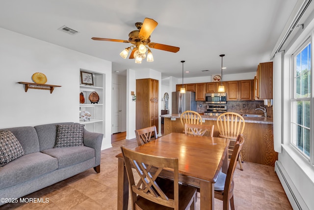 20 Abergele Dr, Toms River, NJ 08757 - dining space with baseboard heating and a ceiling fan
