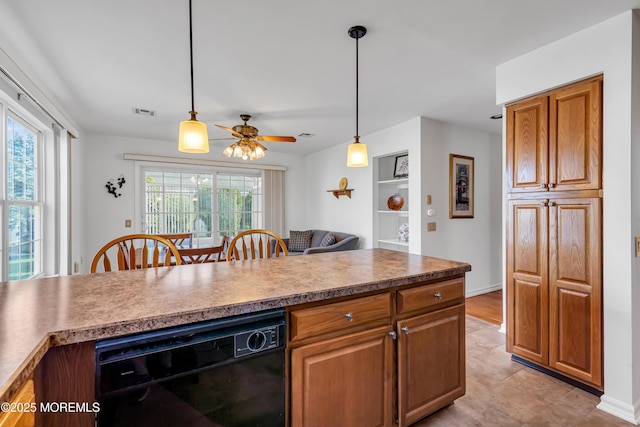 20 Abergele Dr, Toms River, NJ 08757 - kitchen featuring black dishwasher, a ceiling fan, hanging light fixtures, and brown cabinets