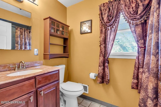 full bathroom featuring tile patterned floors, toilet, and vanity
