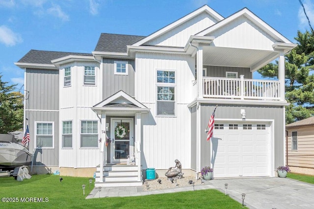 74 Dock Rd, Brick, NJ 08723 - view of front facade featuring a balcony, driveway, an attached garage, roof with shingles, and a front lawn
