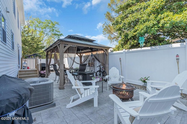 74 Dock Rd, Brick, NJ 08723 - view of patio featuring an outdoor fire pit, a gazebo, central AC, and a fenced backyard