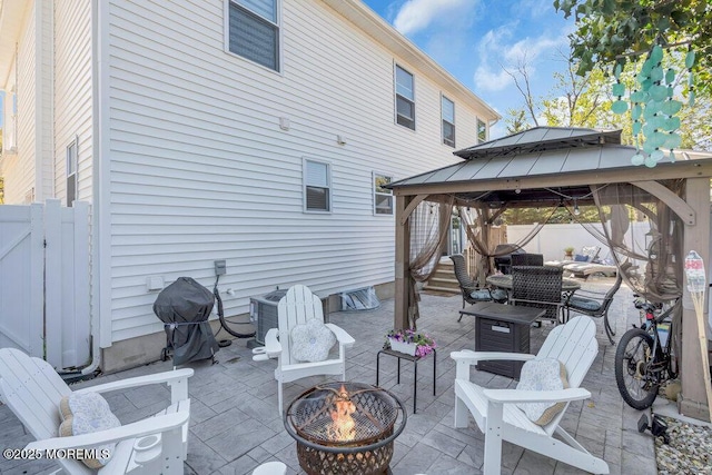 74 Dock Rd, Brick, NJ 08723 - view of patio featuring a fire pit, a gazebo, and fence