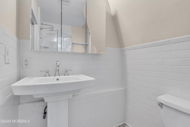 46 Grand Tour, Highlands, NJ 07732 - full bathroom featuring tile walls, toilet, tiled shower, a sink, and wainscoting