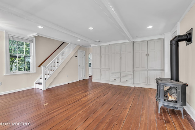 46 Grand Tour, Highlands, NJ 07732 - unfurnished living room with hardwood / wood-style floors, a wood stove, stairway, baseboards, and crown molding