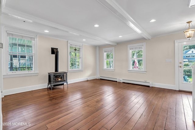 46 Grand Tour, Highlands, NJ 07732 - unfurnished living room with ornamental molding, wood-type flooring, a wood stove, beamed ceiling, and a baseboard radiator