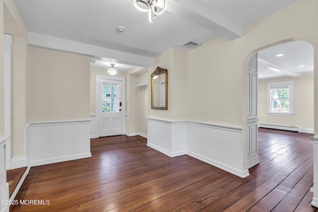 46 Grand Tour, Highlands, NJ 07732 - entryway featuring baseboard heating, arched walkways, hardwood / wood-style floors, baseboards, and beam ceiling