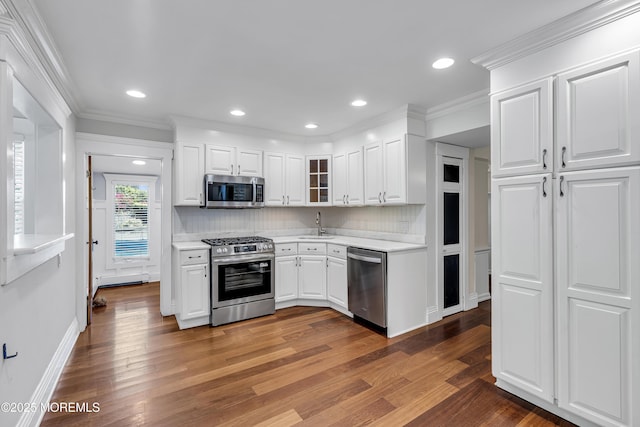 46 Grand Tour, Highlands, NJ 07732 - kitchen with stainless steel appliances, light countertops, decorative backsplash, wood finished floors, and white cabinetry