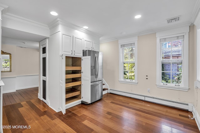 46 Grand Tour, Highlands, NJ 07732 - kitchen featuring freestanding refrigerator, baseboard heating, dark wood-type flooring, white cabinets, and ornamental molding
