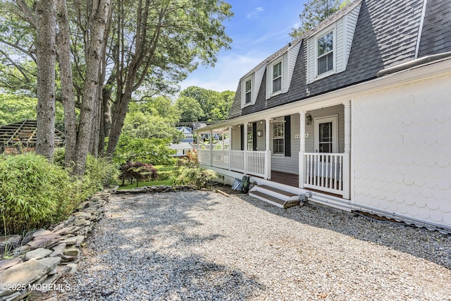 46 Grand Tour, Highlands, NJ 07732 - view of side of home featuring covered porch and roof with shingles