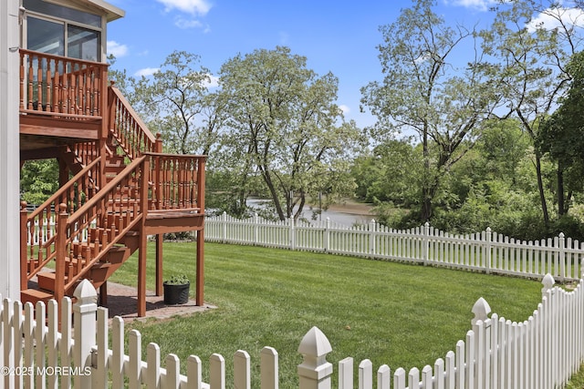 view of yard with stairs and a sunroom