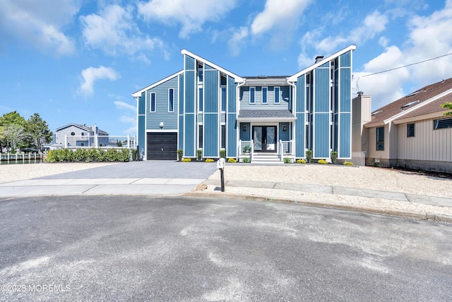 3 Toledo Dr, Brick, NJ 08723 - contemporary home featuring concrete driveway, a garage, and french doors