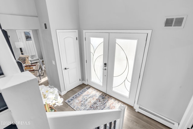 3 Toledo Dr, Brick, NJ 08723 - entryway featuring a baseboard heating unit, wood finished floors, and french doors