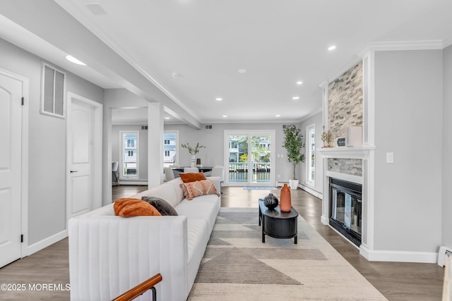 3 Toledo Dr, Brick, NJ 08723 - living area featuring wood finished floors, recessed lighting, a large fireplace, and crown molding