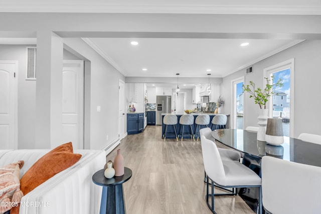 3 Toledo Dr, Brick, NJ 08723 - dining area featuring a baseboard heating unit, light wood finished floors, recessed lighting, and ornamental molding